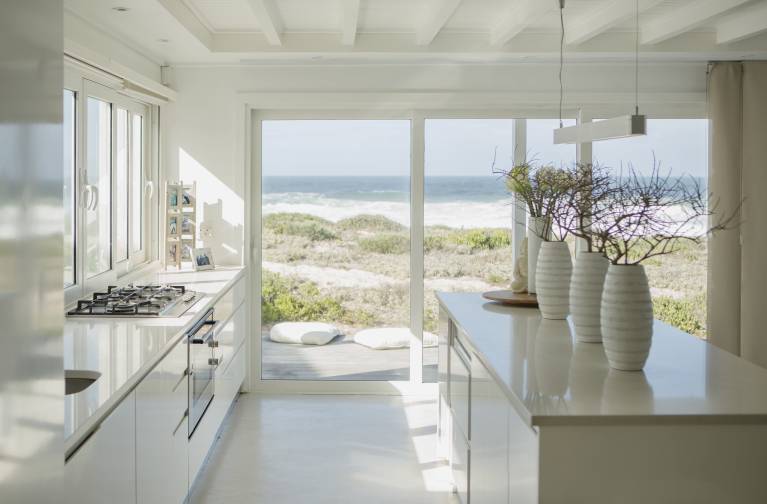 Modern white kitchen with ocean view